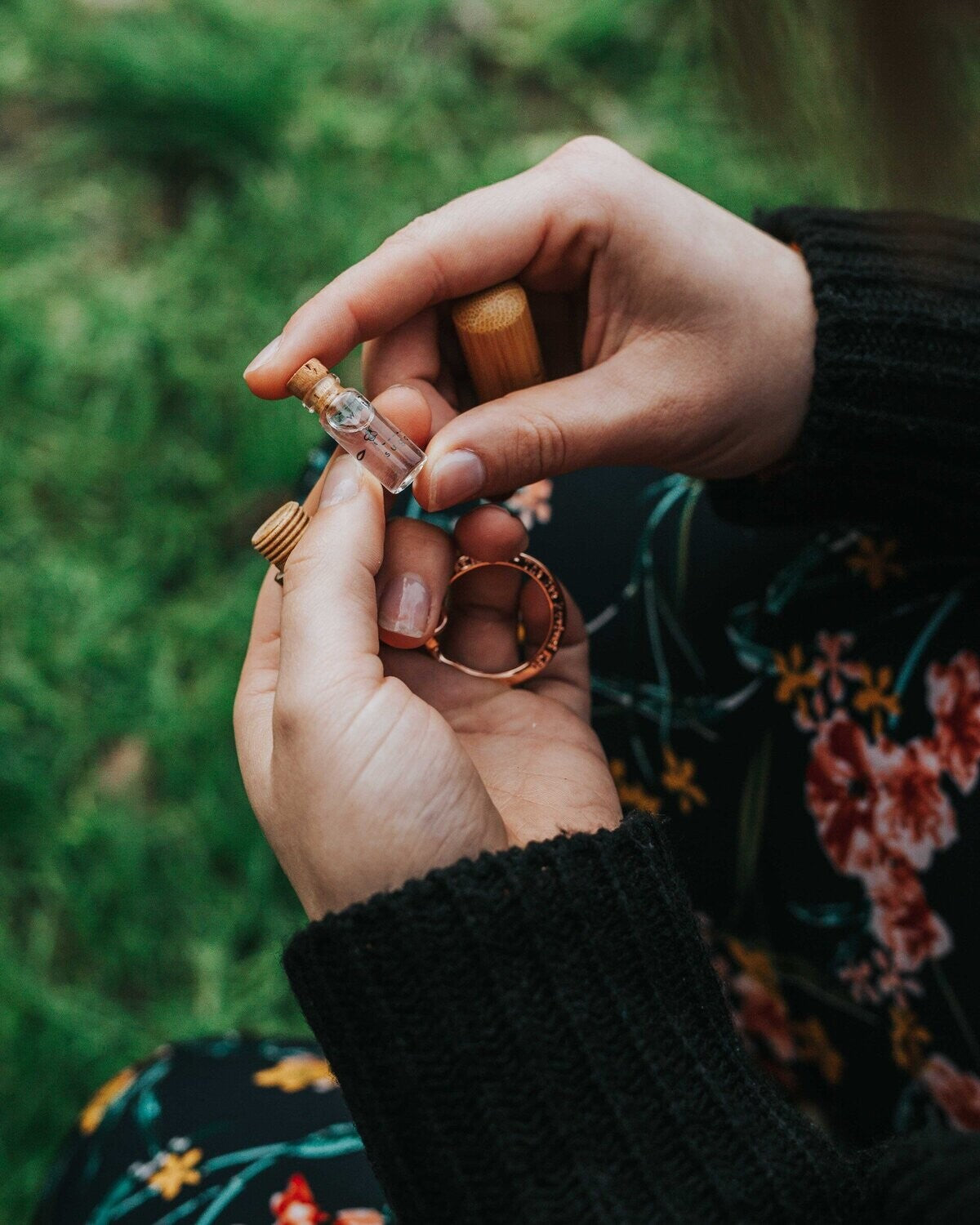rose gold bee revival kit bamboo edition filled bottle being held