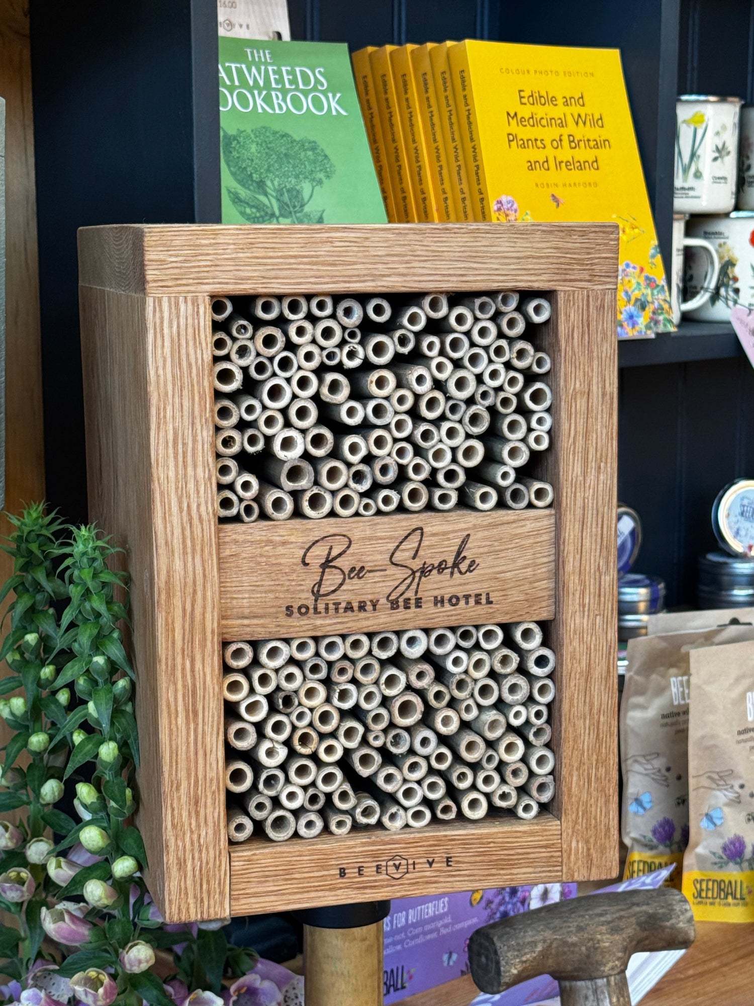 Wooden bee hotel with tubes