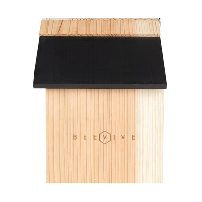side of bee hotel 2.0 out of its cardboard sleeve showing beevive logo in wood available from beevive.com