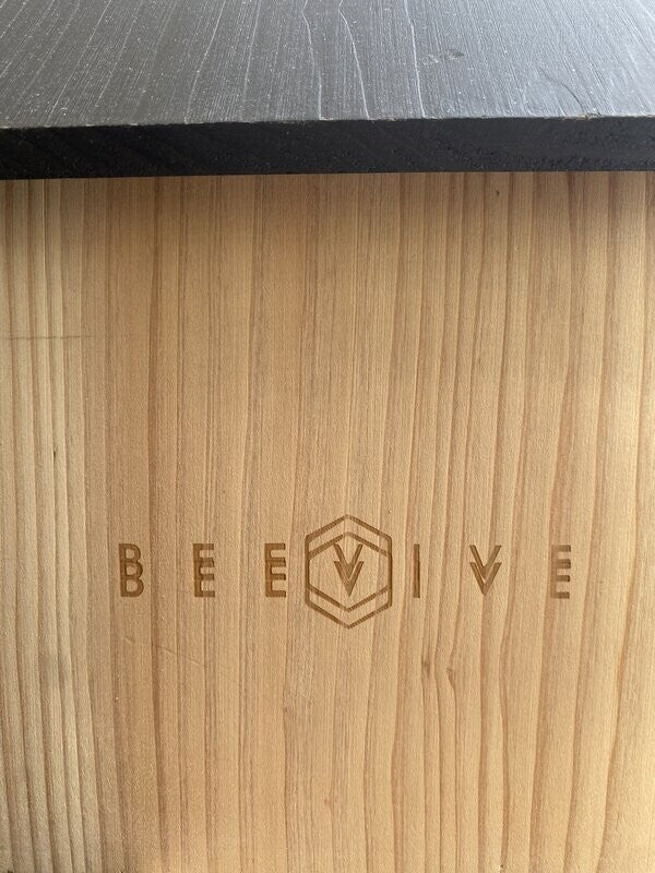 side of non perfect bee hotel 2.0 showing beevive.com logo stamped twice